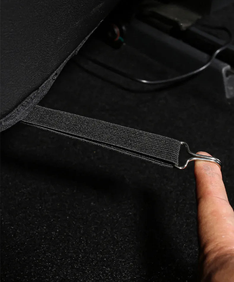 Black leather rear anti kick pad for car seats, shown with storage pocket.