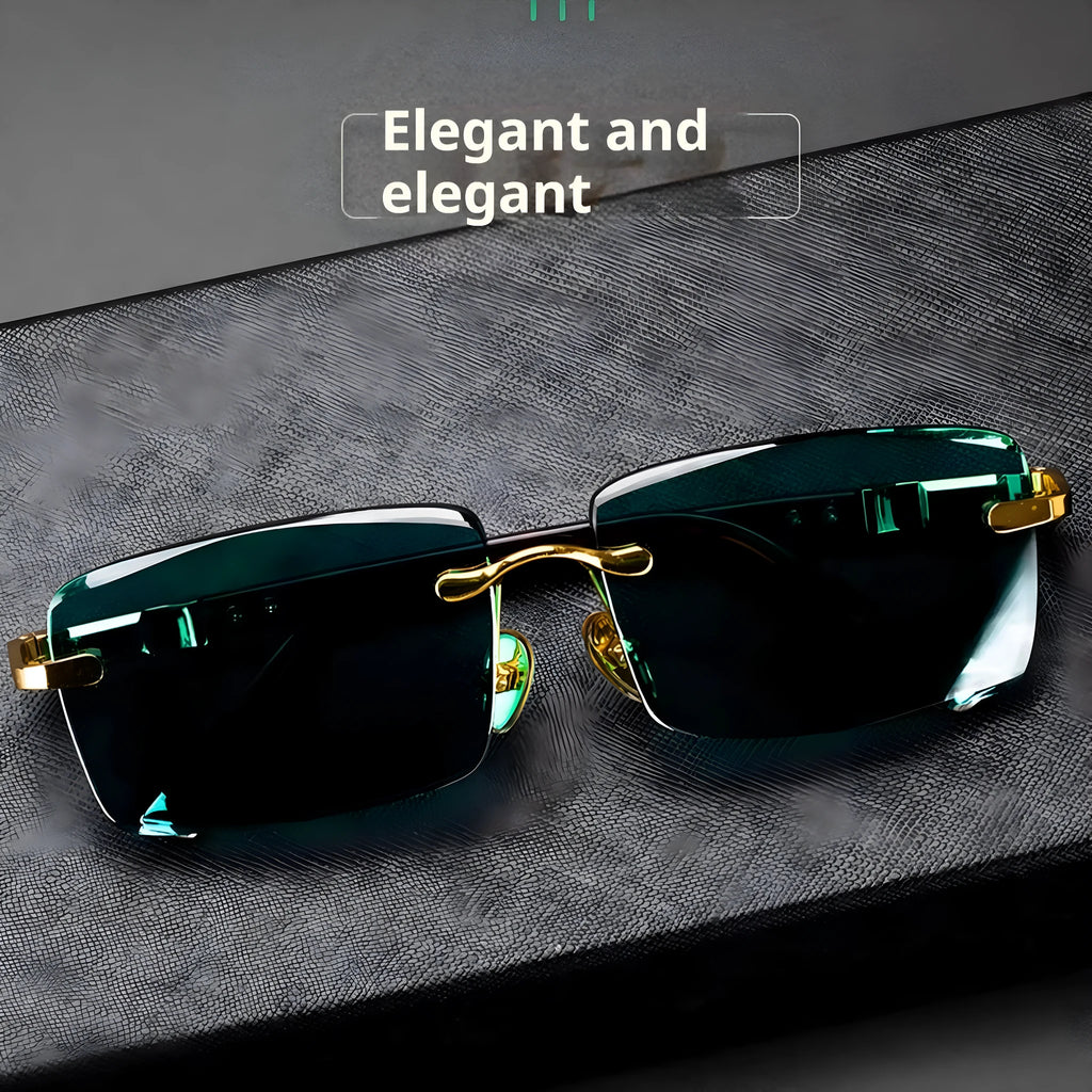 A pair of frameless sunglasses with dark green crystal lenses, shown with a soft case and cleaning cloth.
