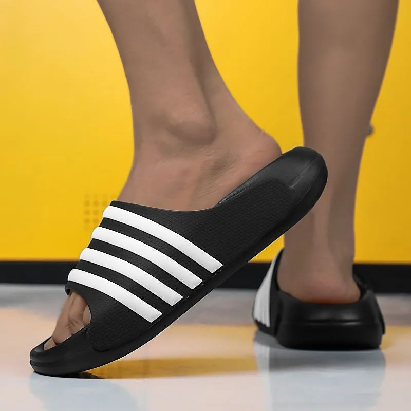 A pair of casual leisure sports style slippers with a PVC upper and EVA sole, shown in beige colour.