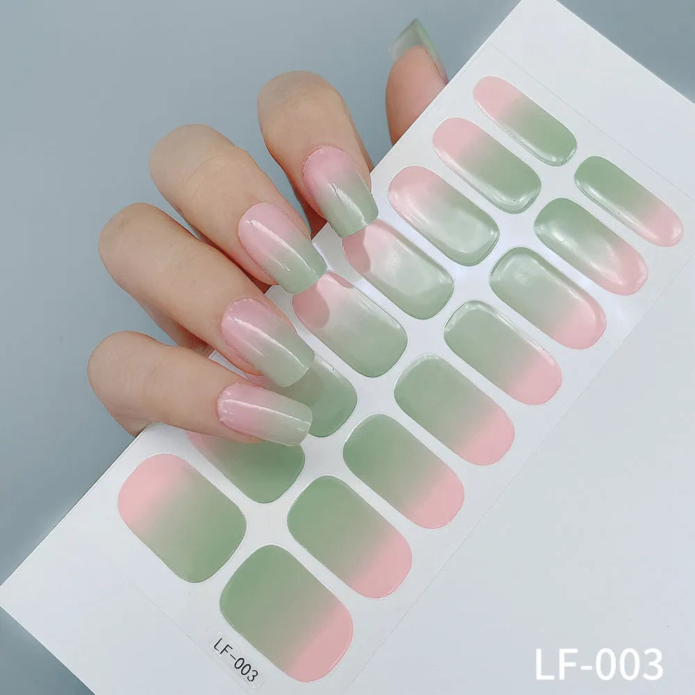 Full coverage nail art stickers sheet with 16 designs including cross, rose, tulip, and cartoon patterns.