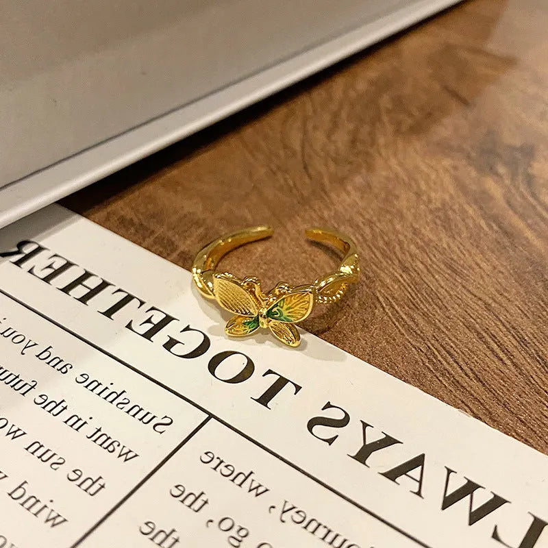 Butterfly women's copper ring with adjustable split ring design showing oil-drip colour treatment