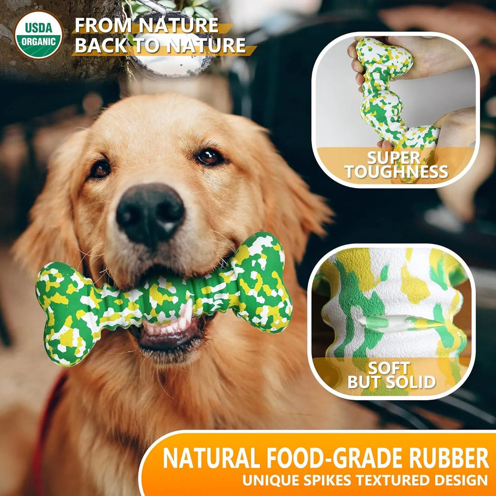 Green and white camouflage patterned natural rubber bone-shaped dog chew toy for large dogs on a wooden floor.