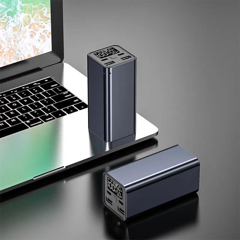 High power laptop charging bank with metal casing showing black, blue, and grey colour options
