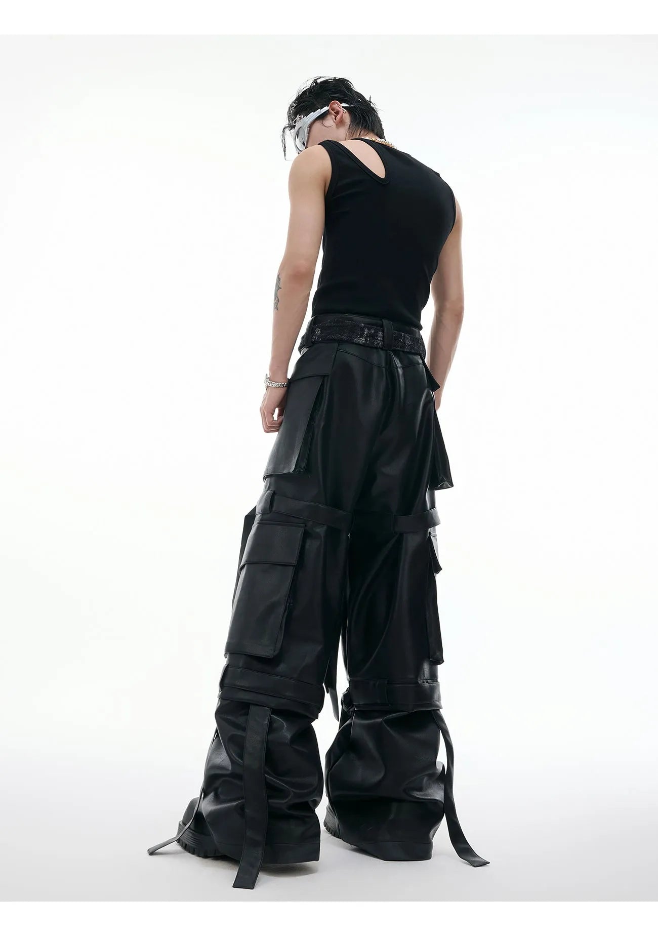 Men's black loose-fit leather trousers with quilted stitching and multiple pockets
