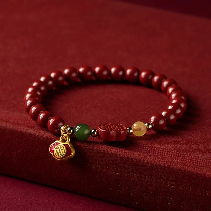 Emperor Sandstone cinnabar bracelet with fu character charm in 6mm and 8mm bead sizes