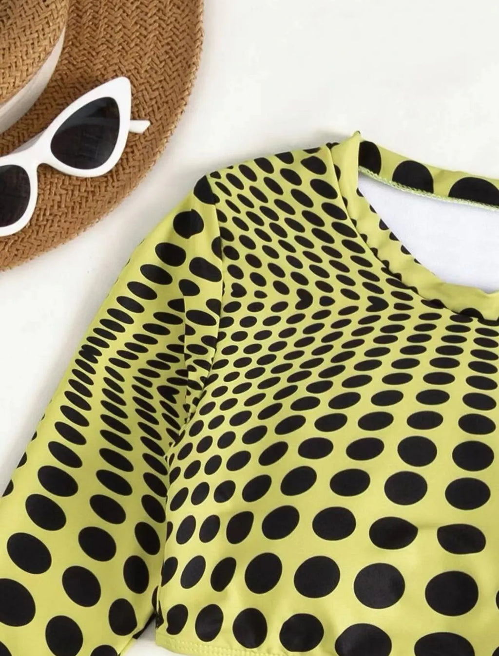 Women's green and yellow polka dot polyester swimsuit three-piece set showing top, skirt, and bra.