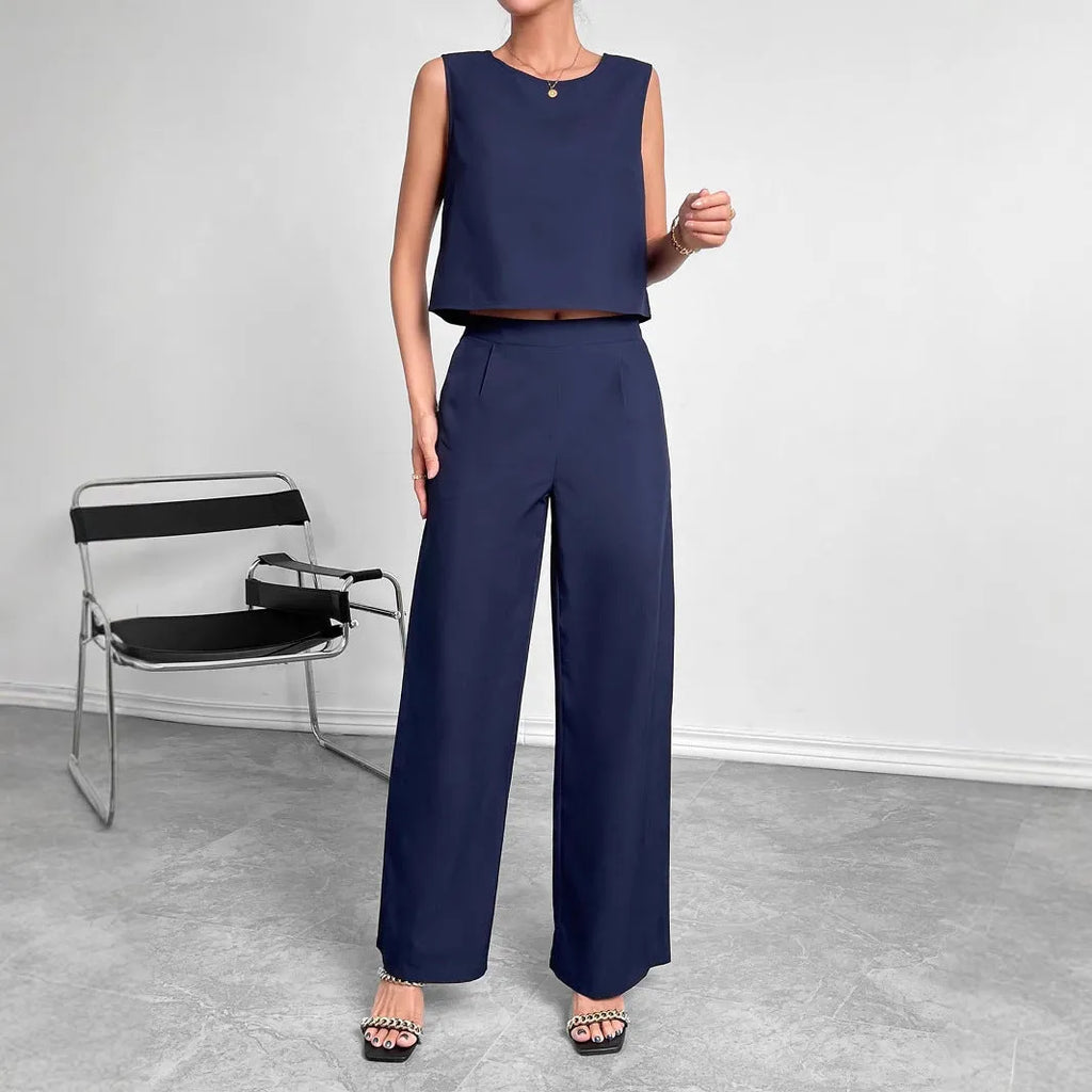 Women's red polyester lounge set featuring sleeveless round neck top and wide leg pants