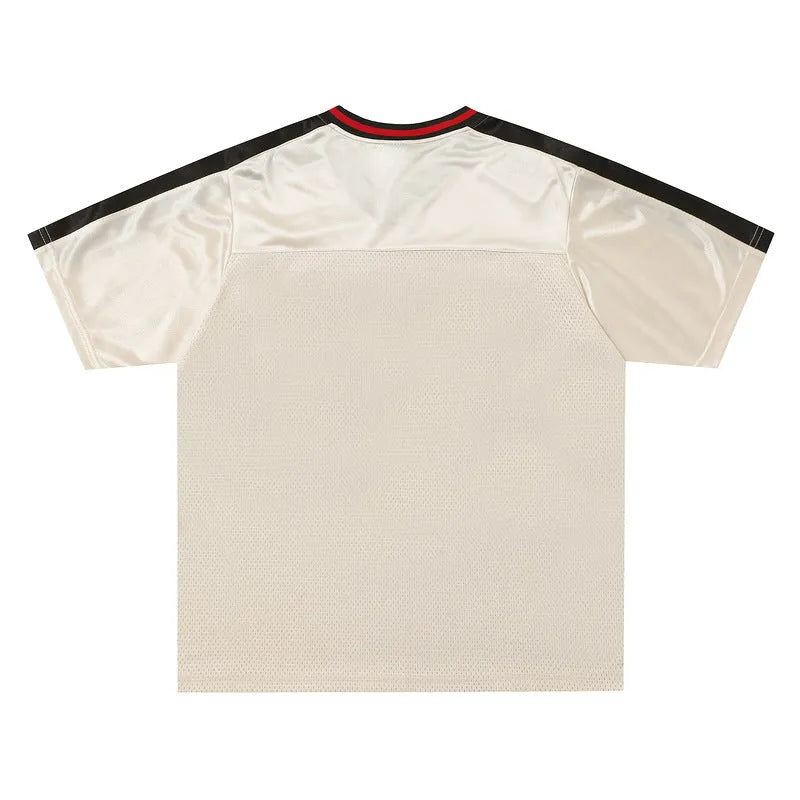 Men's apricot coloured loose fit V-neck sports t-shirt with a large letter pattern on the front.