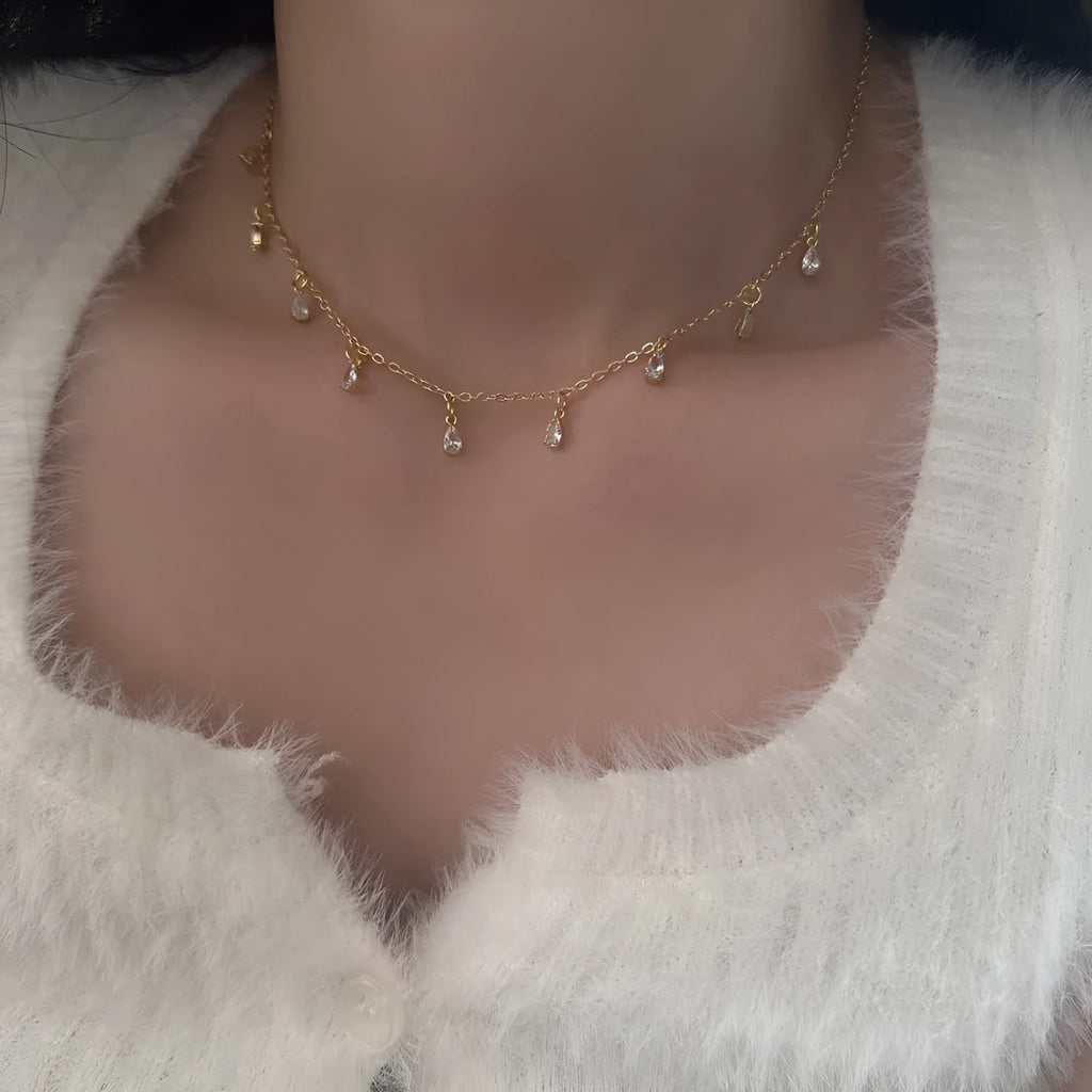 Women's zircon jewellery set with geometric pendant necklace, matching earrings, and anklet