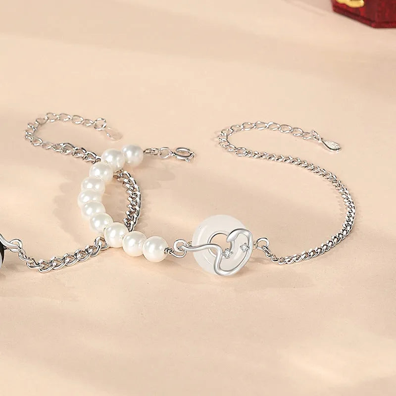 925 sterling silver couple bracelet with snake charm, obsidian pearl, and safe buckle in new Chinese style.