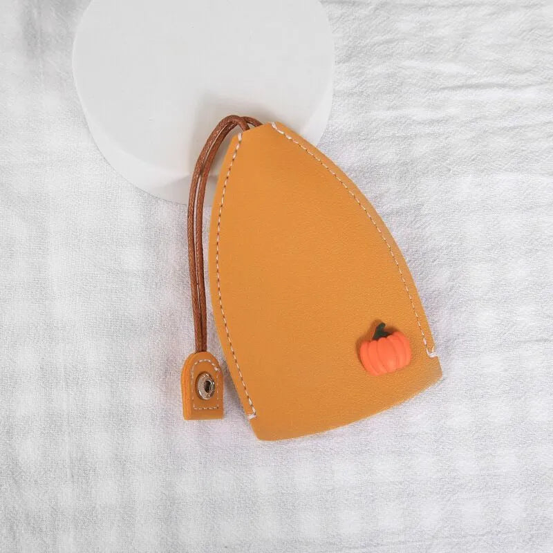Colourful cartoon pull-out key case made from PU leather showing design options