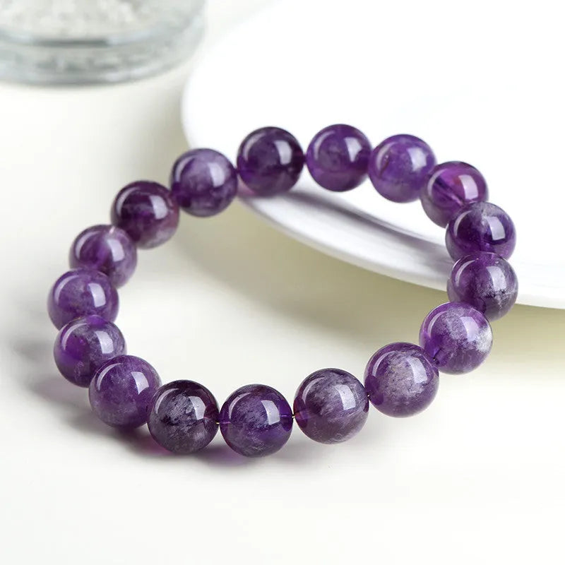 Natural purple crystal bracelet with scattered beads and Ruyi symbol design in various size options.
