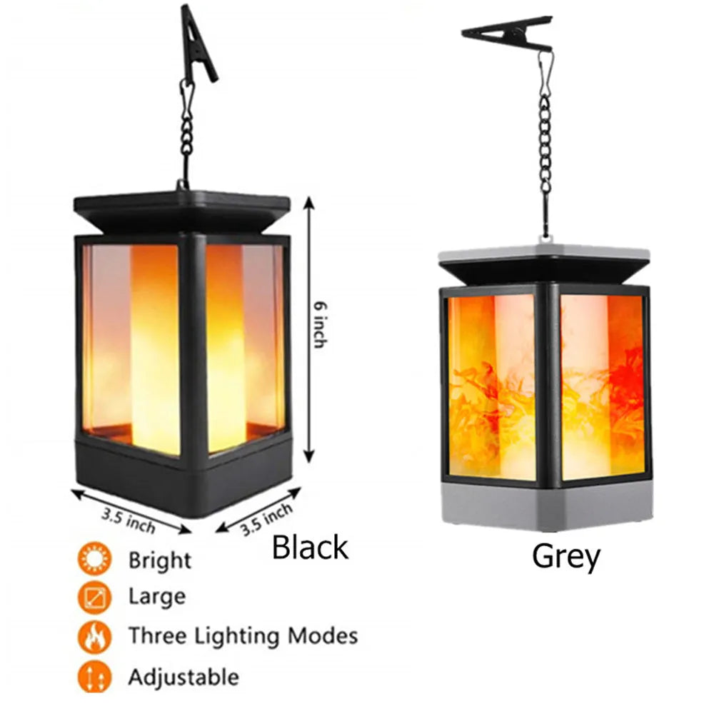 Black antique flame style outdoor solar LED street lamp on a post.