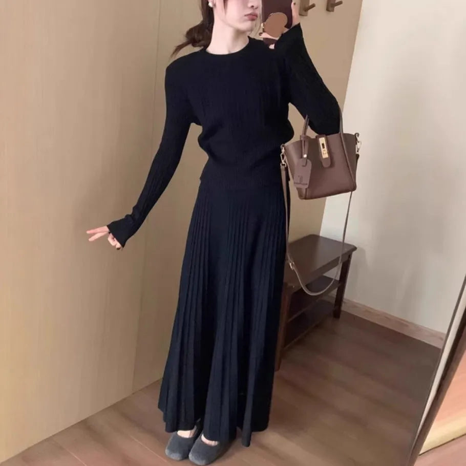 Women's knitted ethnic style dress suit with skirt showing 3D patterns in dark grey colour