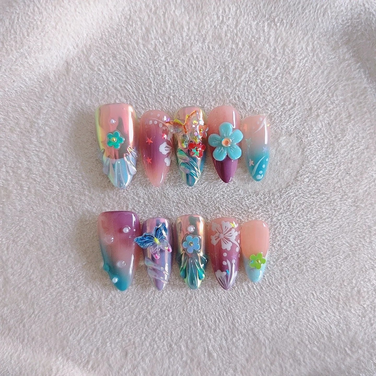Handmade colourful small flower and butterfly nail art sculptures for gel manicure decoration