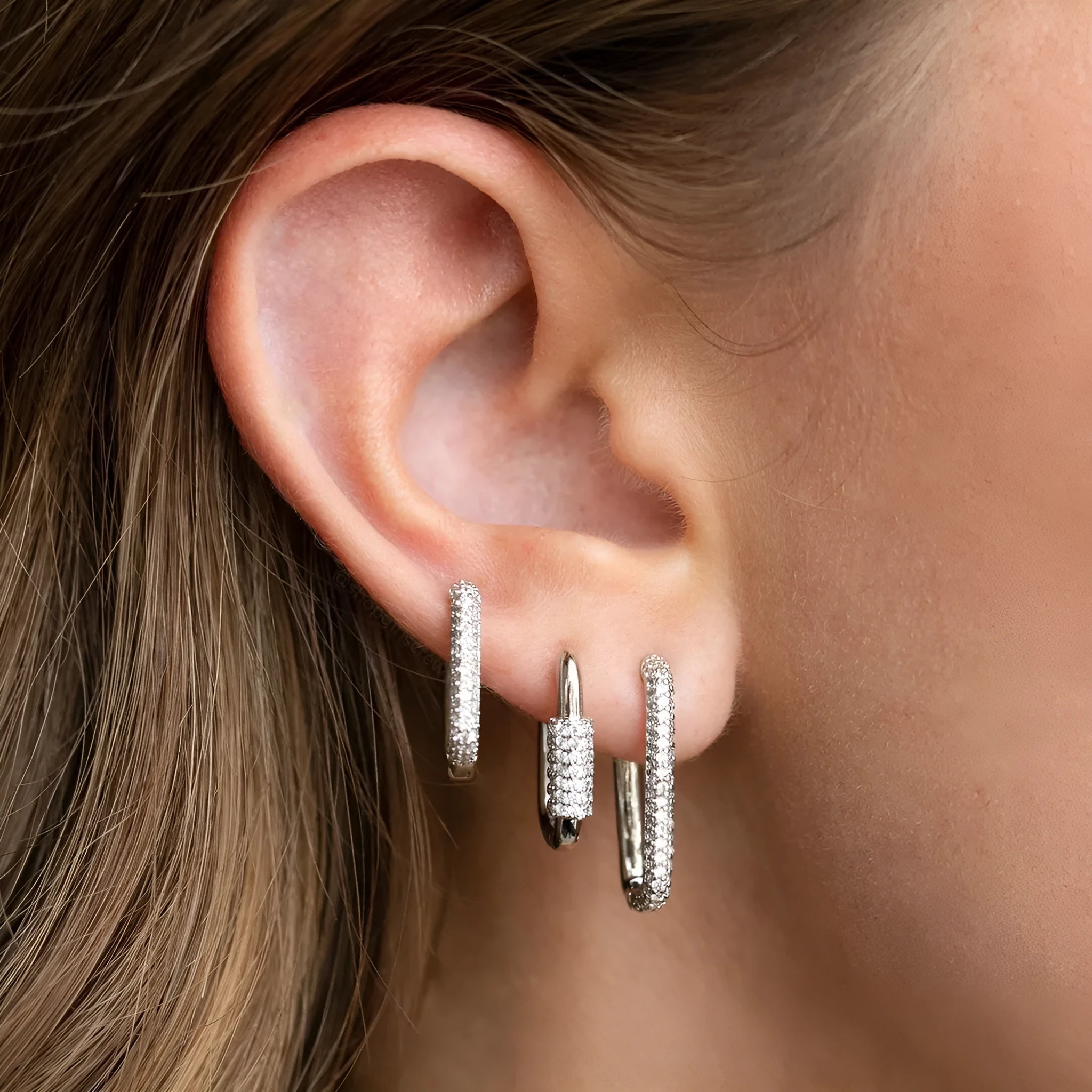 Three geometric ear clips with micro inlaid zircon in gold and white metal colours