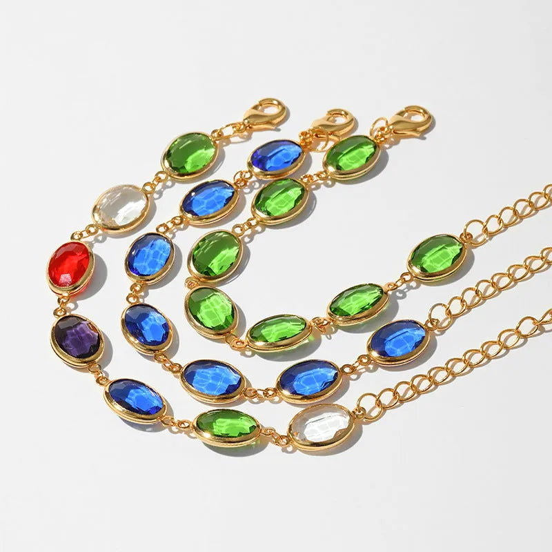 Geometric ellipse women's bracelet with blue glass inlay on an 18K copper band.