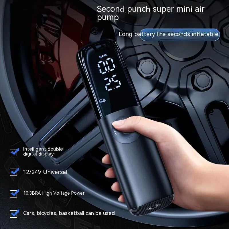 Black portable electric car air pump with tyre pressure gauge and inflation tube