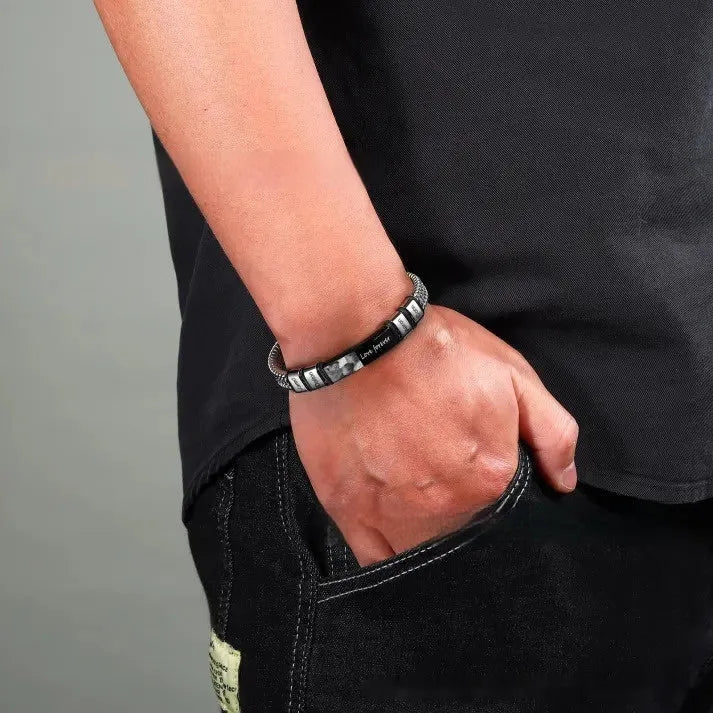 Men's titanium steel lettering bracelet with leather rope strap and heart charm, showing engraved bead options.
