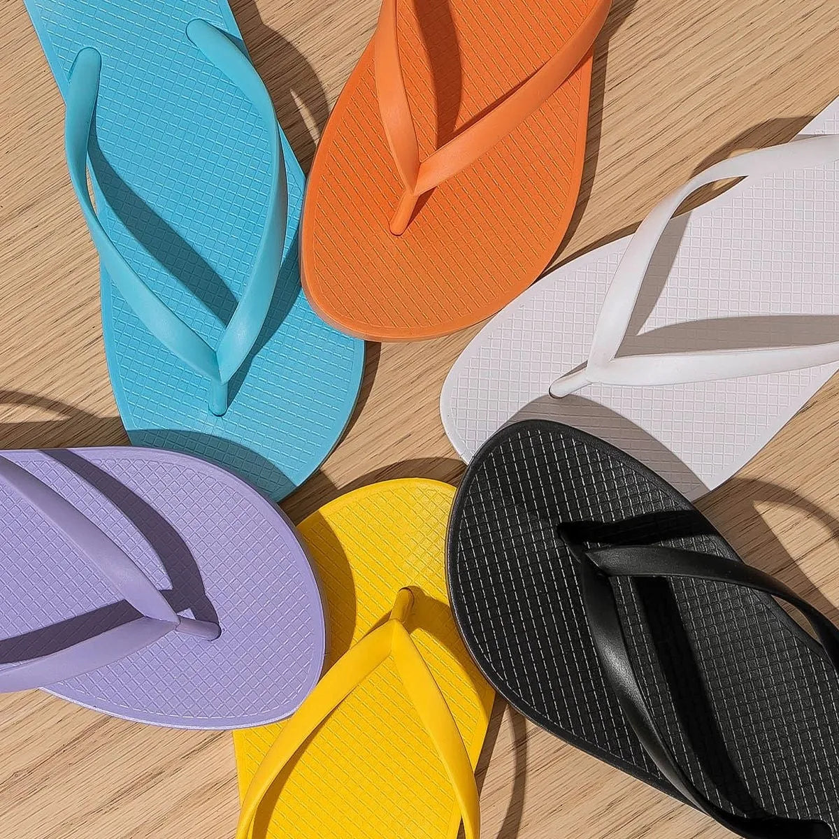 Foldable orange beach slippers with non-slip PVC soles and breathable hollow-out design