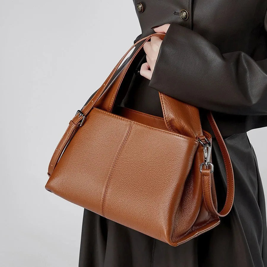 Genuine cowhide messenger bag in horizontal square shape with double shoulder straps and retro texture