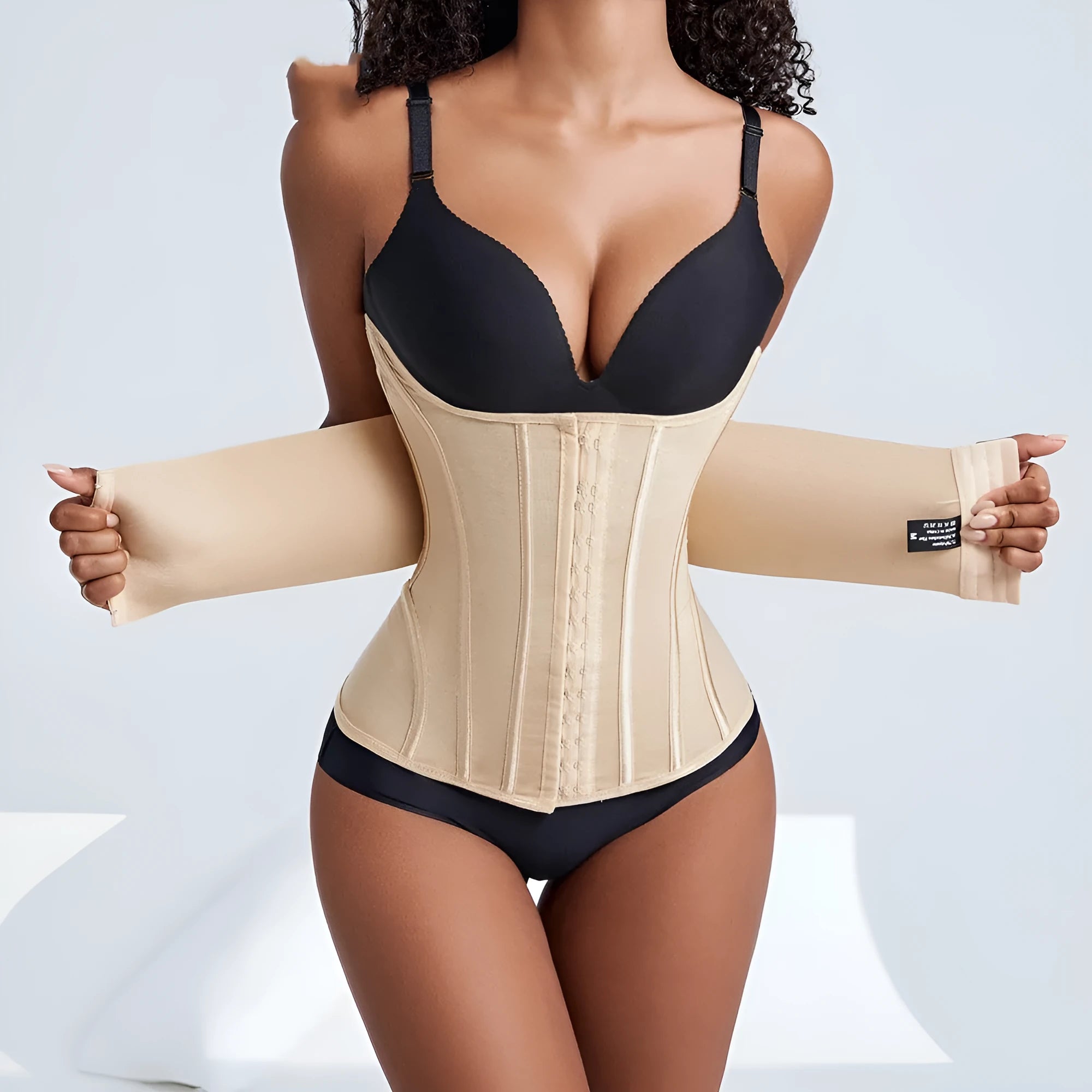 Nylon belly band waist trainer in black and apricot colours with adjustable belt tie