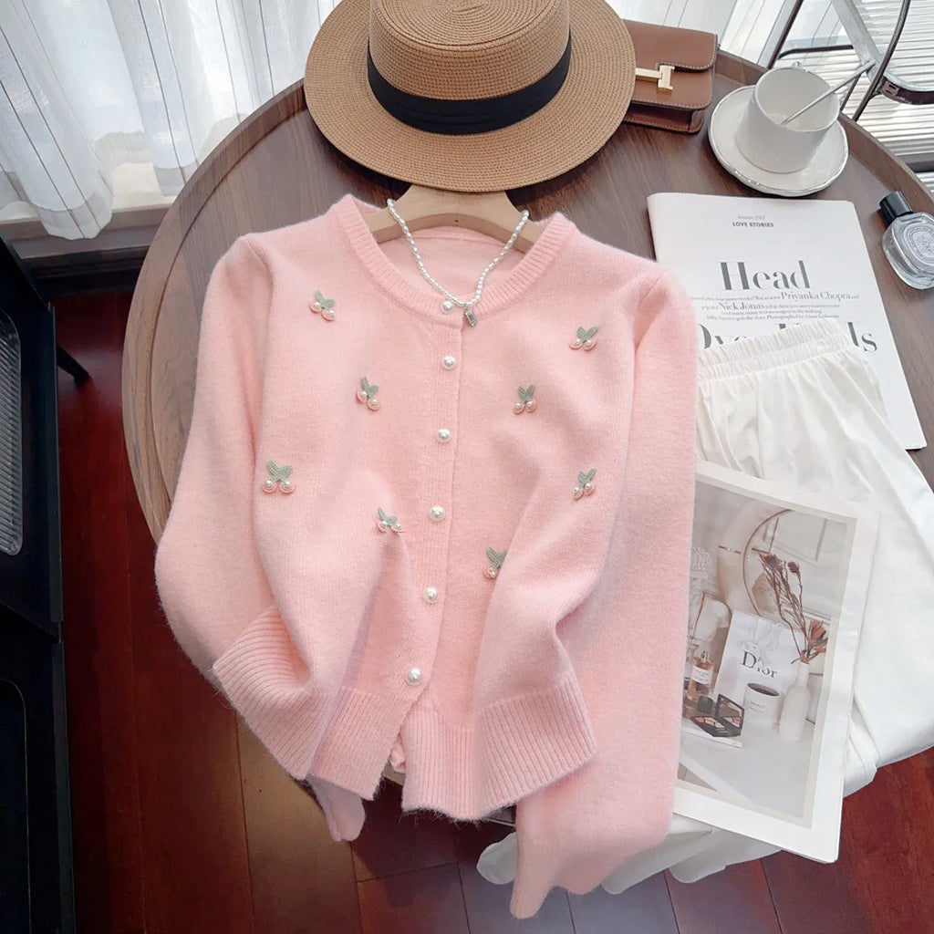 Pink cashmere-nylon cardigan coat with beaded details, round neck, and slim fit.