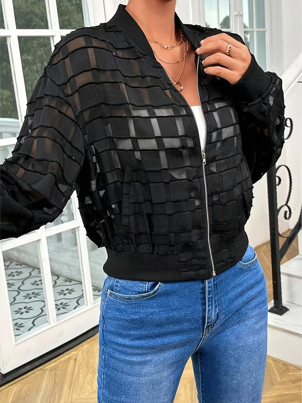 Black women's casual jacket with semi-transparent geometric pattern and zip front.