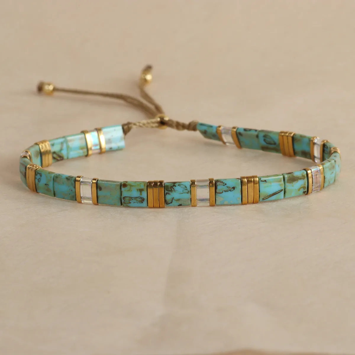 Geometric glass beaded bracelet in milky white, black, green, blue, or red with round elements