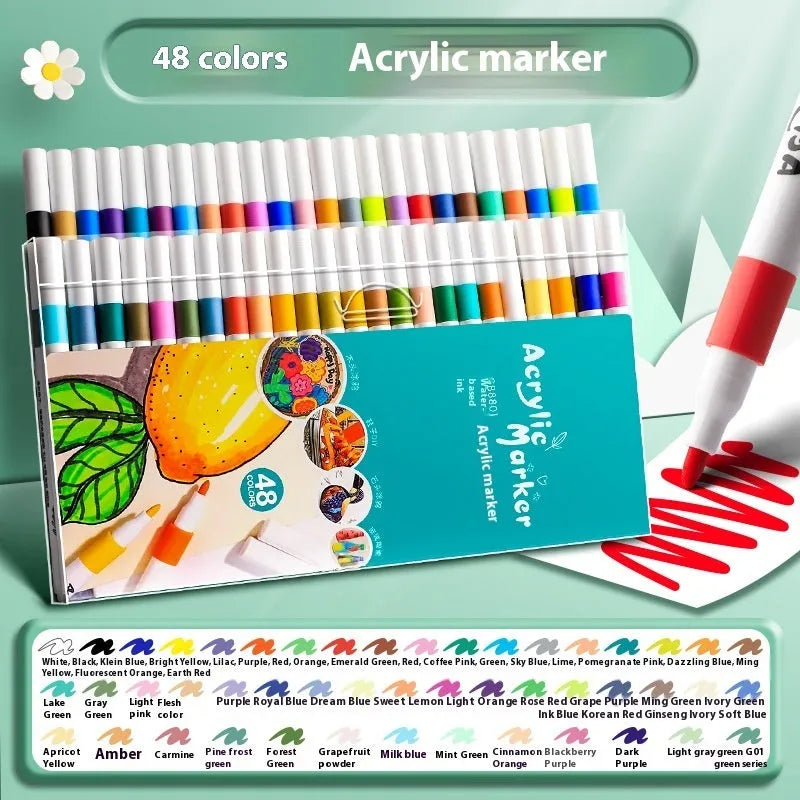Box of multicoloured acrylic marker pens for student painting, showing plastic pen casings.