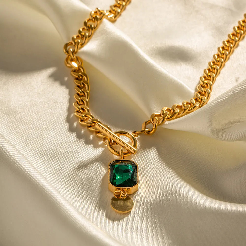 Gold plated titanium steel necklace with emerald zircon geometric round pendant on Cuban link chain