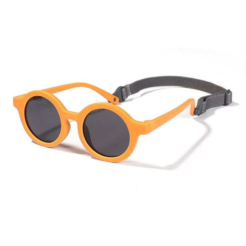 Soft silicone round-frame sunglasses for babies and toddlers aged 0-3 years with polarised UV400 lenses.