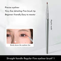 Angled bend head synthetic eyeliner brush for tear trough and under-eye concealer application.