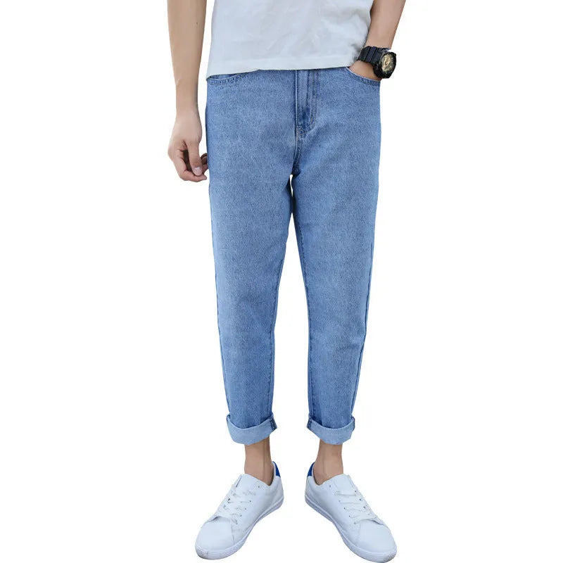 Men's loose straight harem jeans in black cotton fabric showing straight leg opening
