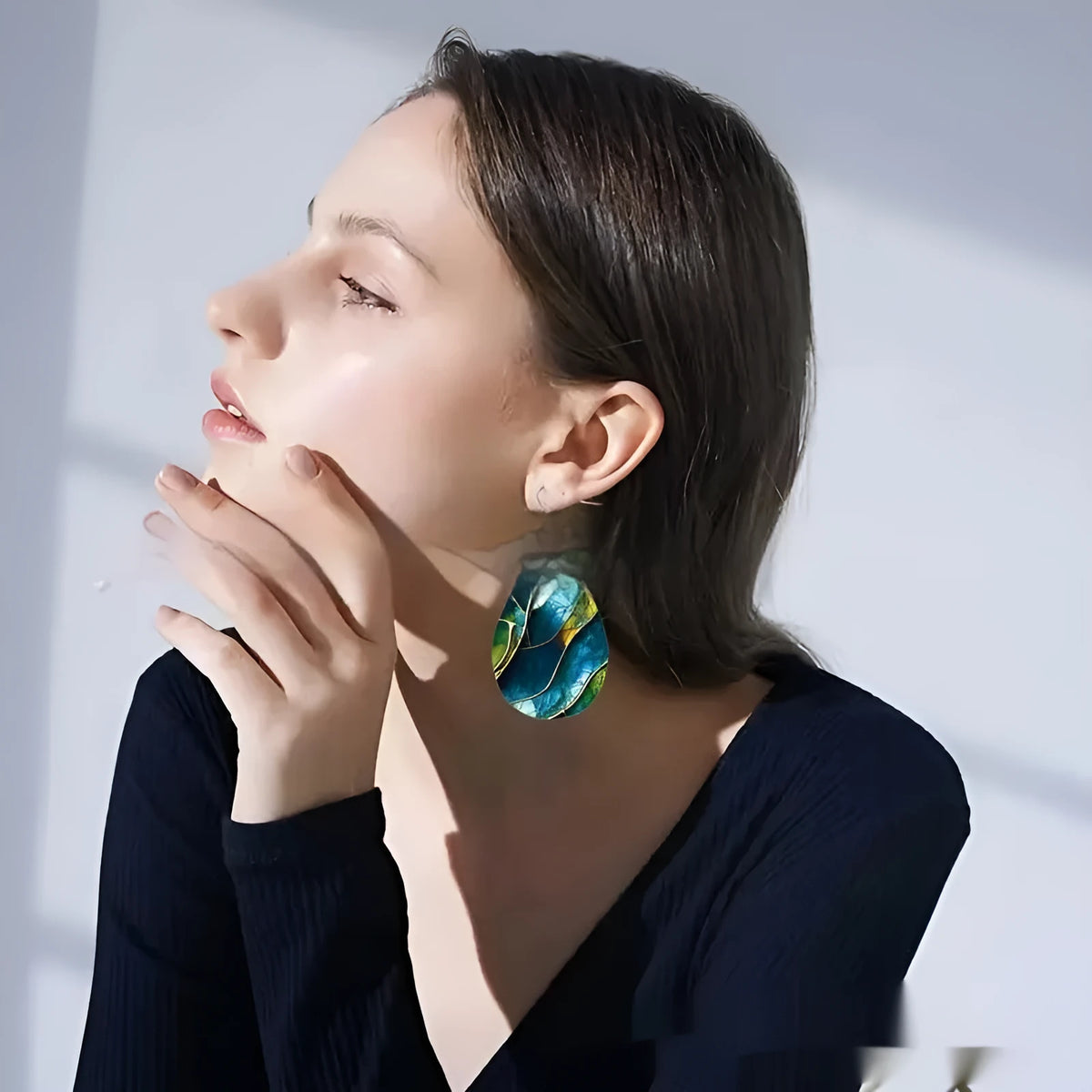 A pair of flat branch knot design drop earrings made from printed acrylic, shown in a selected style.