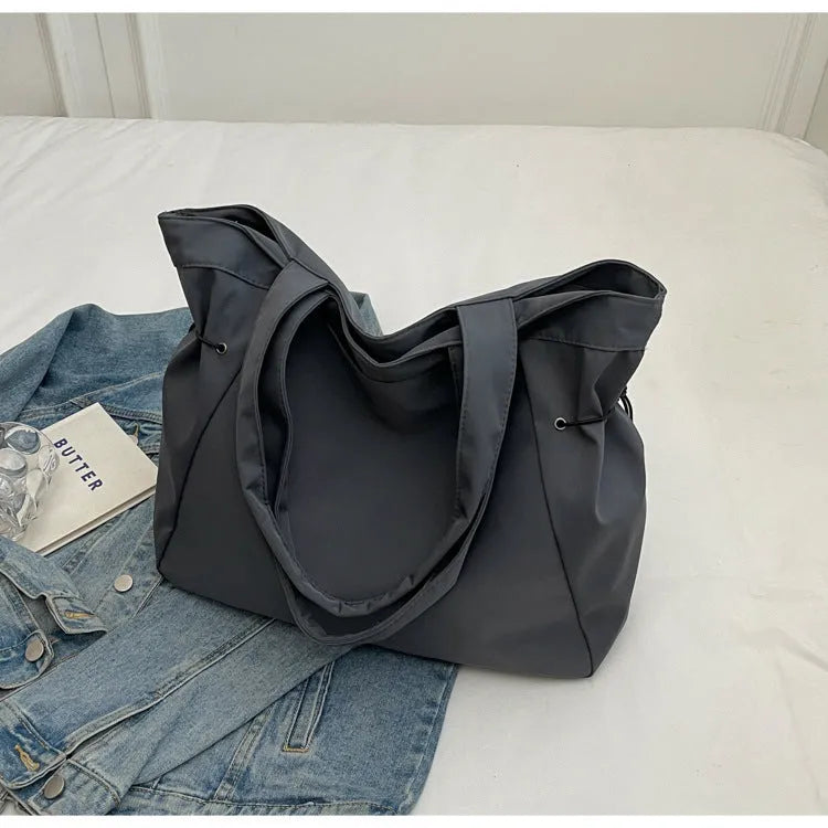 Soft foldable Oxford cloth commuter shoulder tote bag in street trend style.