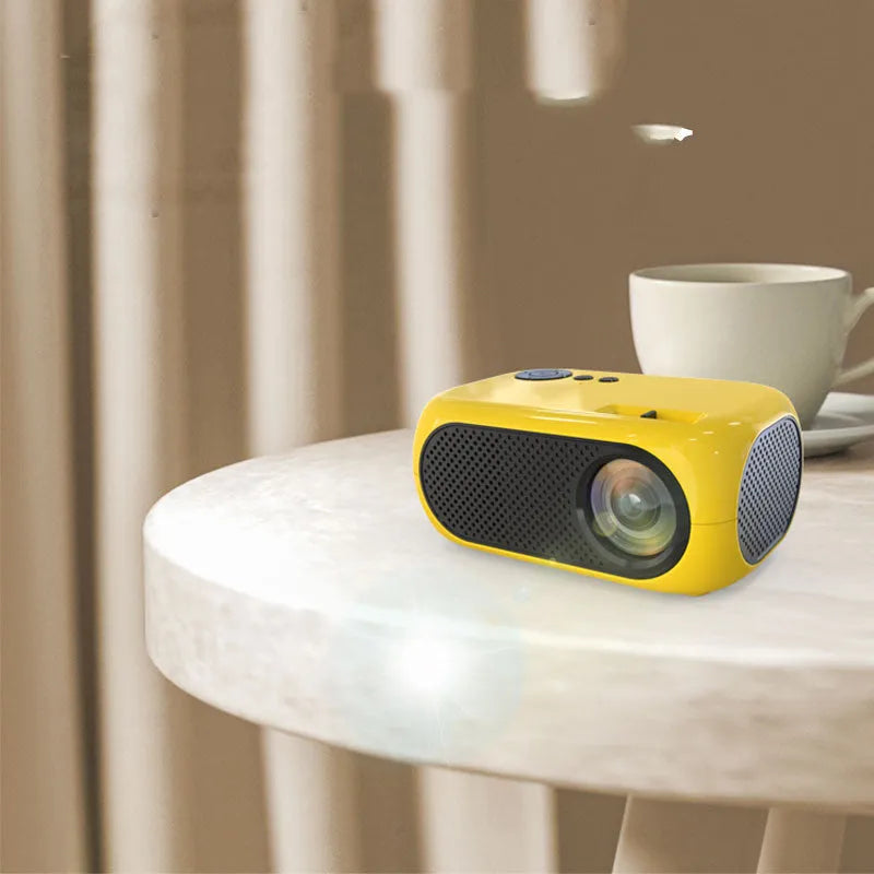 M24 micro mini projector in gold or white with power adapter and AV cable