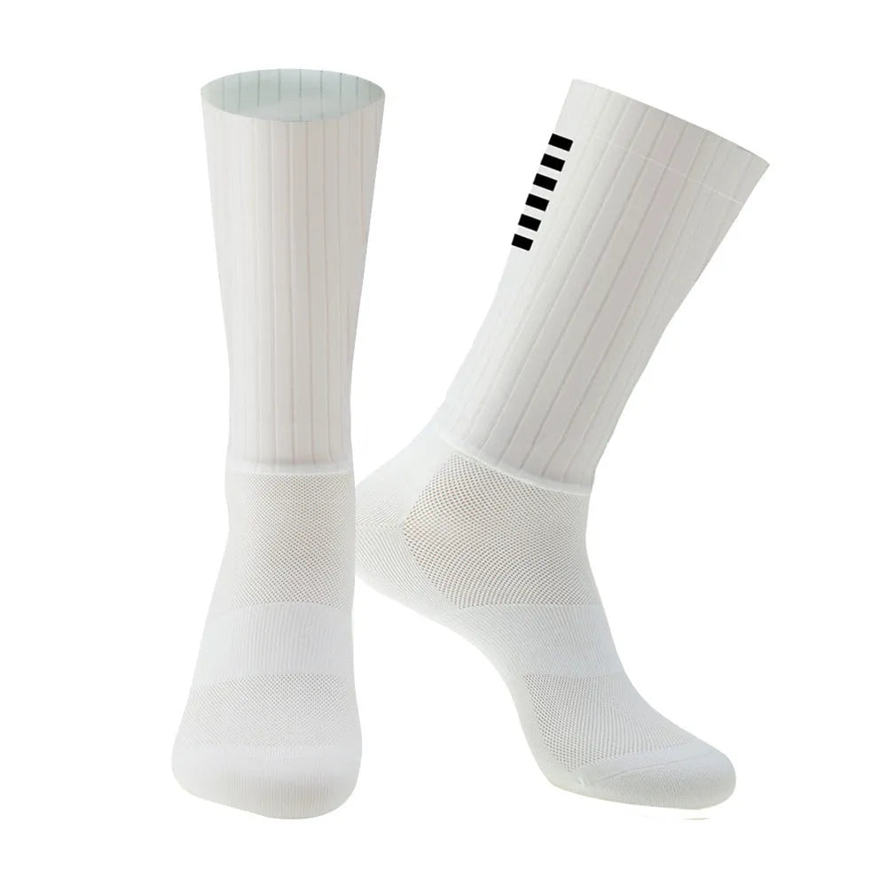 Athletic sports socks for cycling and running in six colour options including orange, black, and purple.