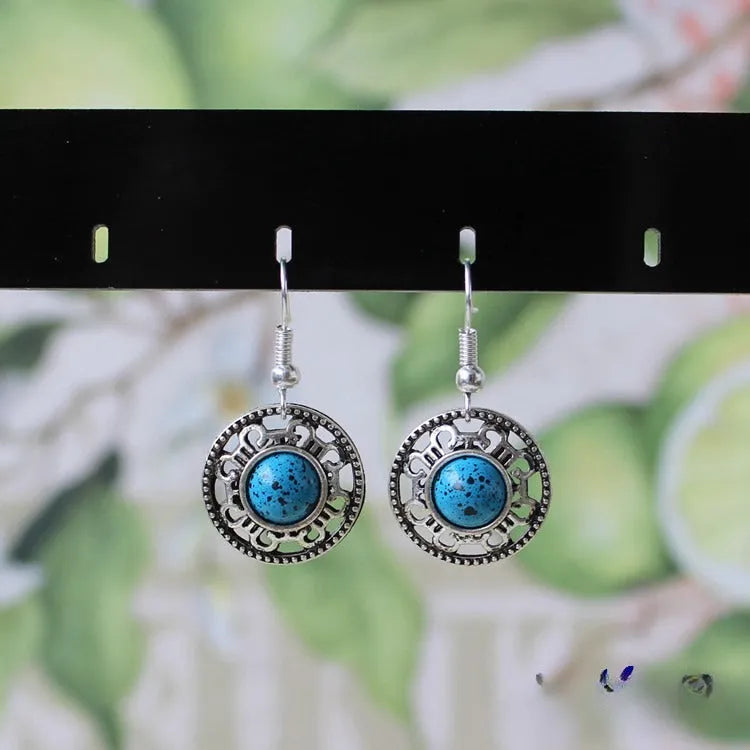 Ethnic Miao silver earrings with turquoise flower disk and geometric auspicious patterns