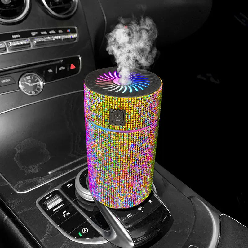 Compact white car air purifier and humidifier unit with USB cable on car dashboard