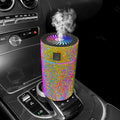 Compact white car air purifier and humidifier unit with USB cable on car dashboard