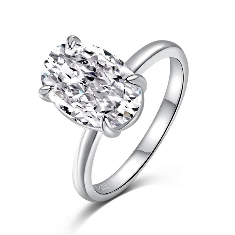Oval silver ring with four-claw setting displaying hand-cut gemstone centrepiece