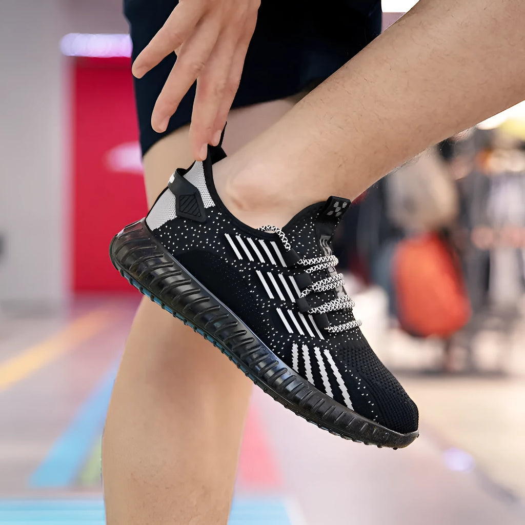 Men's white breathable flying fabric sports shoes with mesh lining and shallow opening.