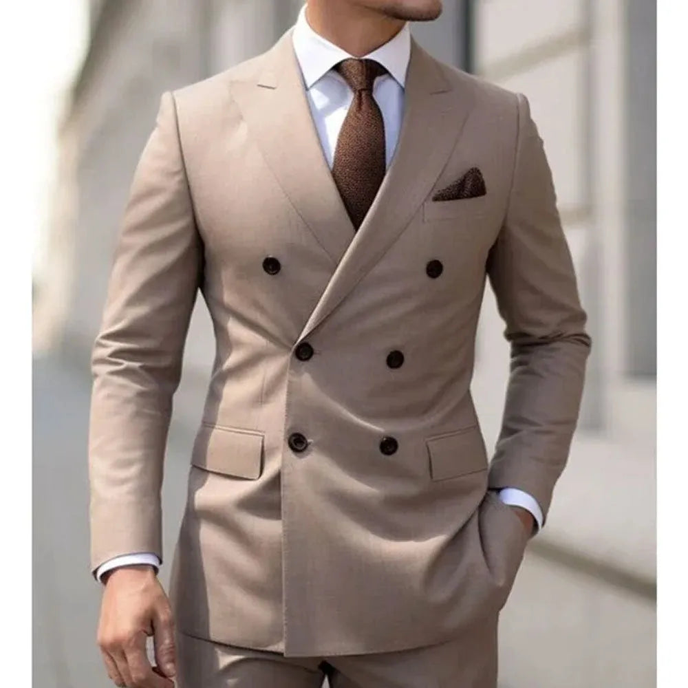 Men's slim fit two-piece suit in a cotton blend fabric, shown in a light business or banquet setting.