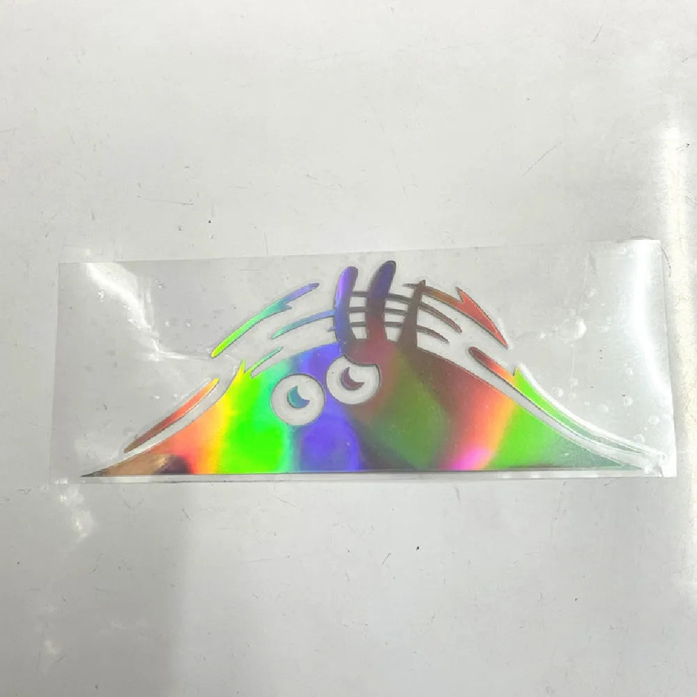 Large 19cm by 7cm self-adhesive body sticker showing four face design options.