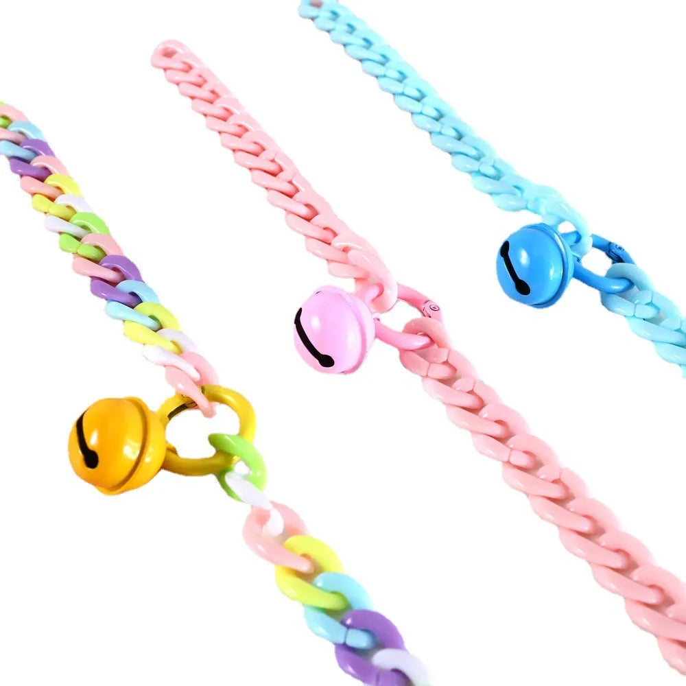 Adjustable plastic pet collar in macaron candy colours on a white background.