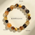 Natural yellow women's bracelet with 10mm artificial crystal string beads on a wrist.