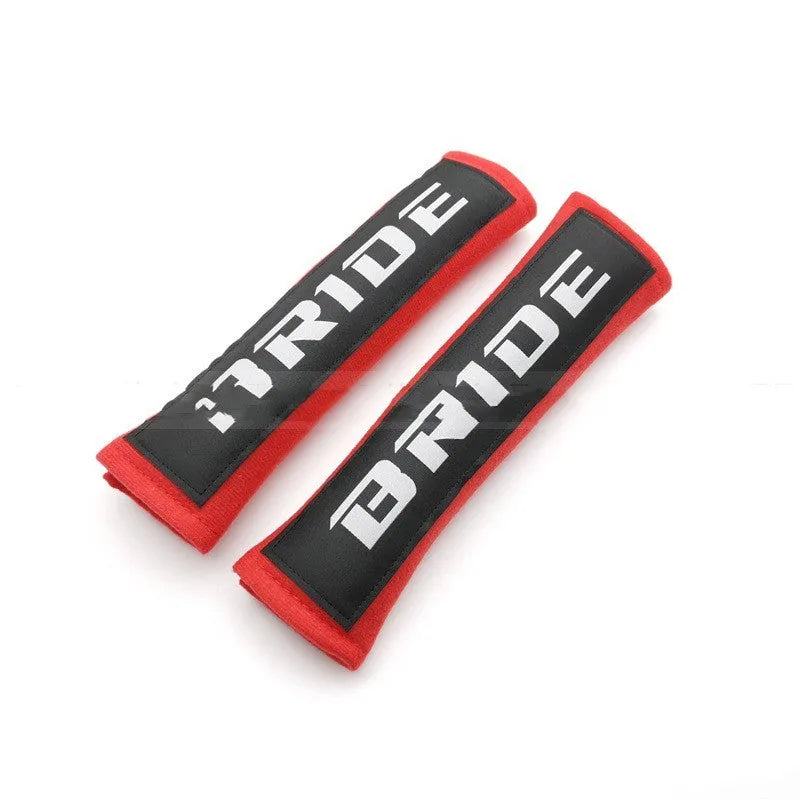 Car seatbelt shoulder pads with embroidery detail in black, blue, and red colour options