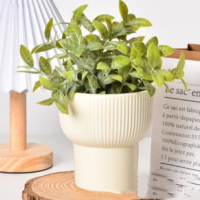 Roman column style matte yellow ceramic flowerpot for home plant decoration.