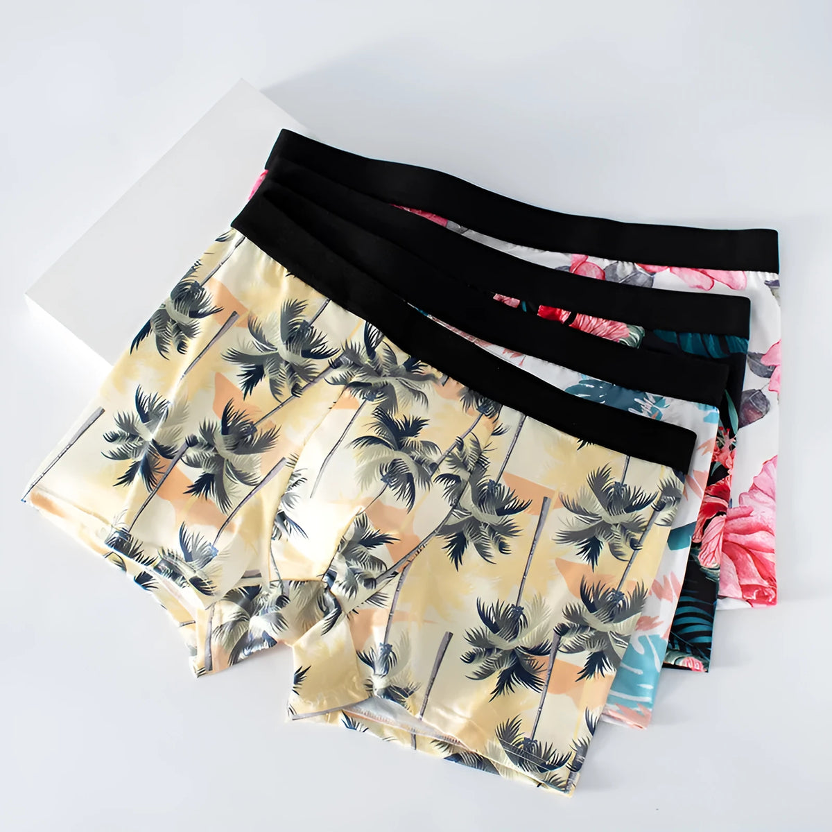Men's ice silk printed underwear in floral pattern showing mid waist design and lightweight fabric